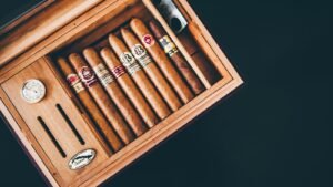 Close-up of premium cigars in a wooden humidor box